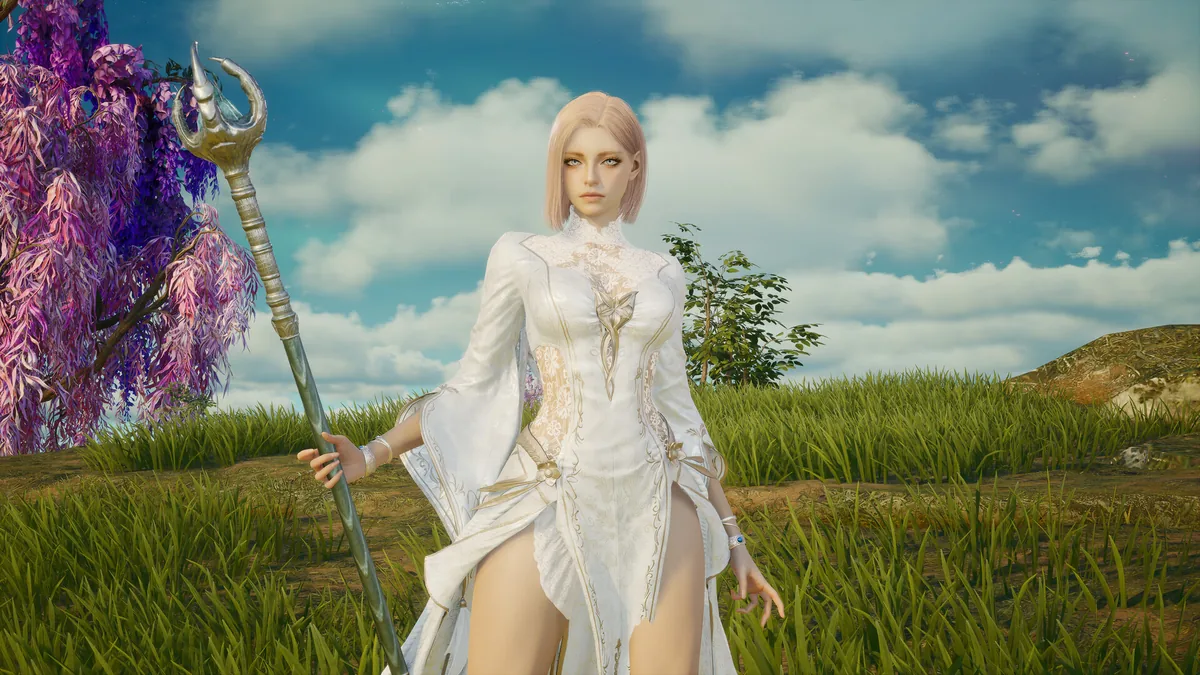 AION 2 mage character in white robes standing in a meadow